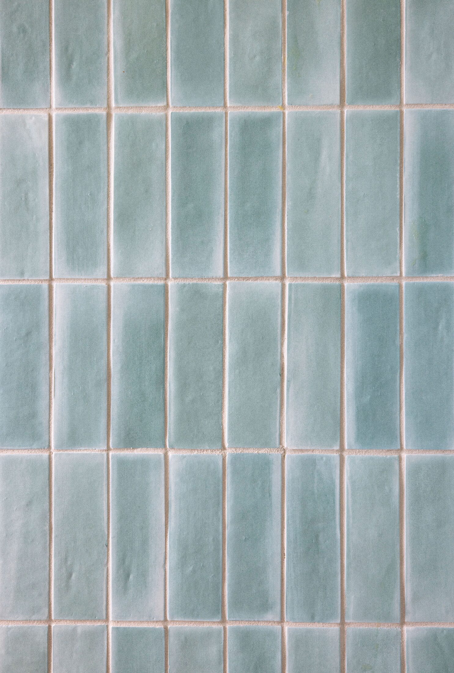 Detail of hand-glazed teal tile installation by Build Shepherd